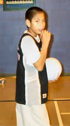 First Nations young man playing volleyball